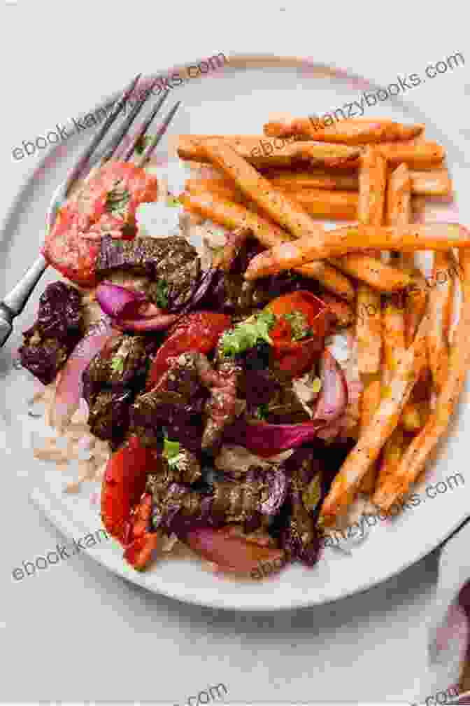 Lomo Saltado, A Stir Fried Beef Dish With Vegetables And Potatoes, Served With Rice The Big Peruvian Cookbook: 100 Delicious Traditional Recipes From Peru